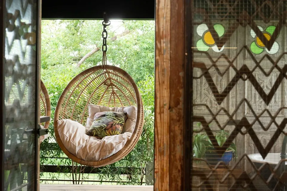 hanging chairs framed by restored french doors