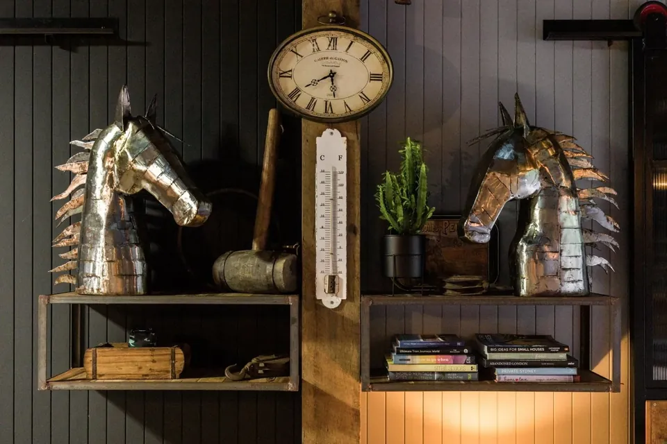 the horse heads — a nod to the stables this once was